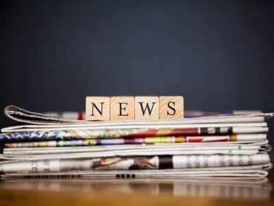 wooden letters on newspaper