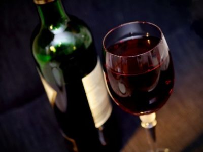 Picture of a bottle and glass of red wine