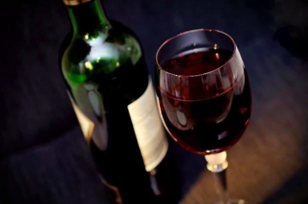 Picture of a bottle and glass of red wine